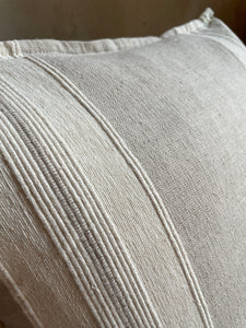 Woven detail on artisan pillow. Gray and white weave.