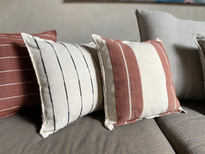 Collection of handwoven striped pillows. 