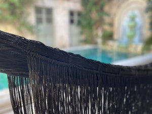 Handwoven balck hammock fringe detail.